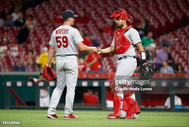 Mike Mayers and Francisco Pena of the St. Louis Cardinals shake hands after the final out of the 13-4 win over the Cincinnati Reds at Great American...