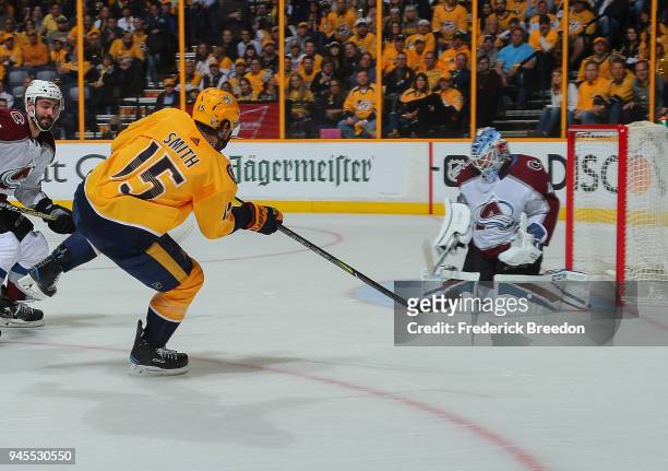 Craig Smith of the Nashville Predators shoots wide of goalie Jonathan Bernier of the Colorado Avalanche during the first period in Game One of the...