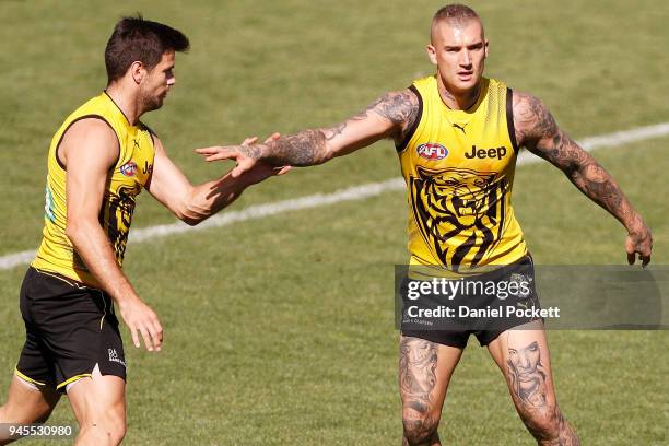 Trent Cotchin of the Tigers and Dustin Martin of the Tigers compete during the Richmond Tigers AFL training session at Punt Road Oval on April 13,...