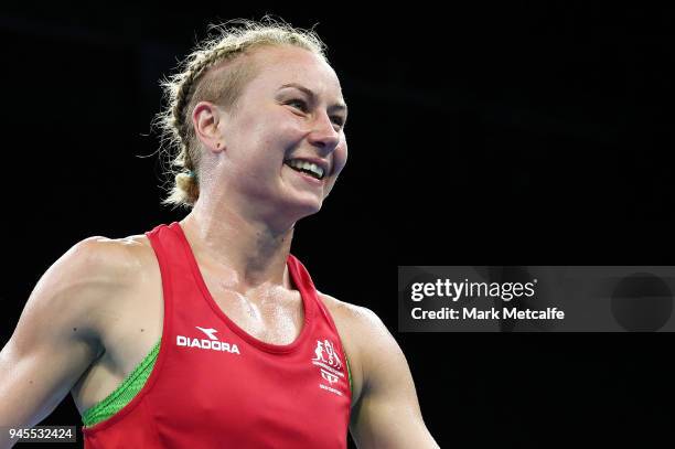 Anja Stridsman of Australia celebrates winning her Women's Light 57-60kg Semifinal bout against and Troy Garton of New Zealand during Boxing on day...