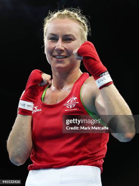 Anja Stridsman of Australia celebrates winning her Women's Light 57-60kg Semifinal bout against and Troy Garton of New Zealand during Boxing on day...