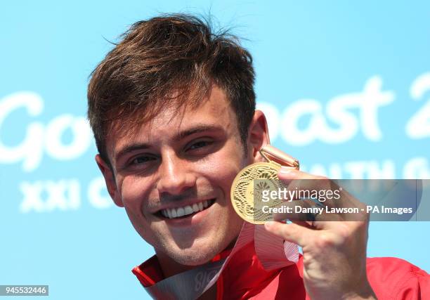 England's Tom Daley with his gold medal in the Men's Synchronised 10m Platform Final at the Optus Aquatic Centre during day nine of the 2018...