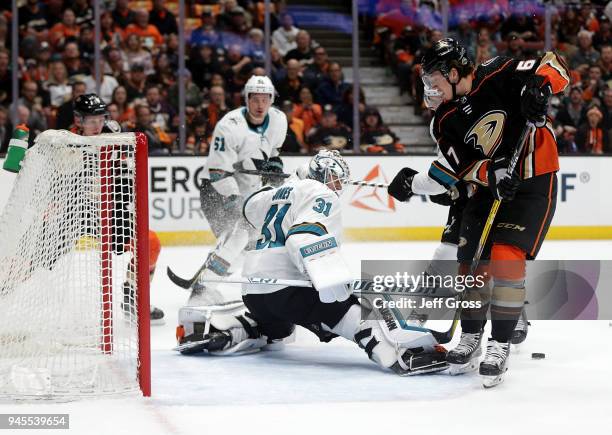 Goaltender Martin Jones of the San Jose Sharks makes a save on Rickard Rakell of the Anaheim Ducks in the first period in Game One of the Western...