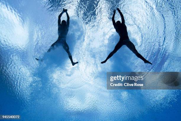 Jellson Jabillin and Hanis Nazirul Jaya Surya of Malaysia compete in the Men's Synchronised 10m Platform Diving Final on day nine of the Gold Coast...