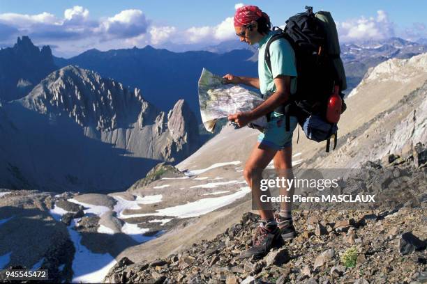 In the Cerces mountain range, hiker in the Red lake basin, who has just gone across the Casse Blanche ridge to reach the Red lake. Dans le Massif des...