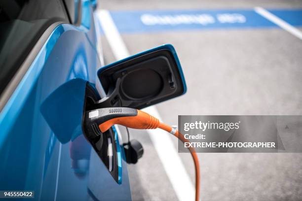 electric car charger - hybrid car stock pictures, royalty-free photos & images