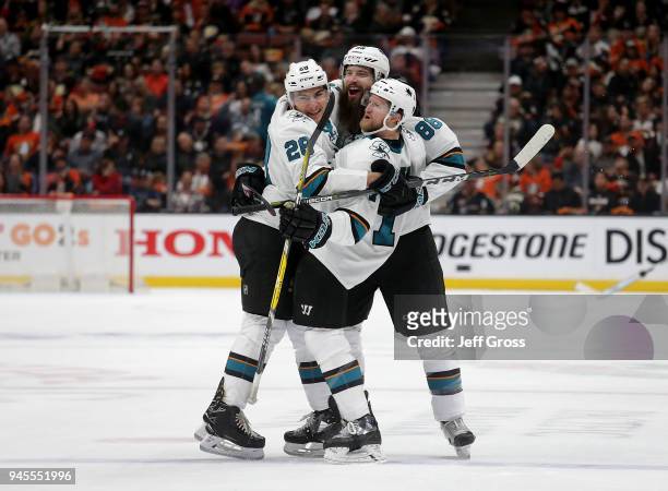 Timo Meier, Brent Burns and Paul Martin of the San Jose Sharks celebrate Burns' goal in the second period against the Anaheim Ducks in Game One of...