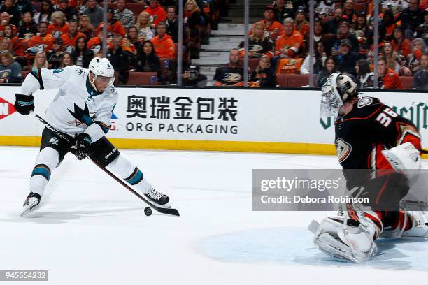 Evander Kane of the San Jose Sharks skates with the puck against John Gibson of the Anaheim Ducks in Game One of the Western Conference First Round...