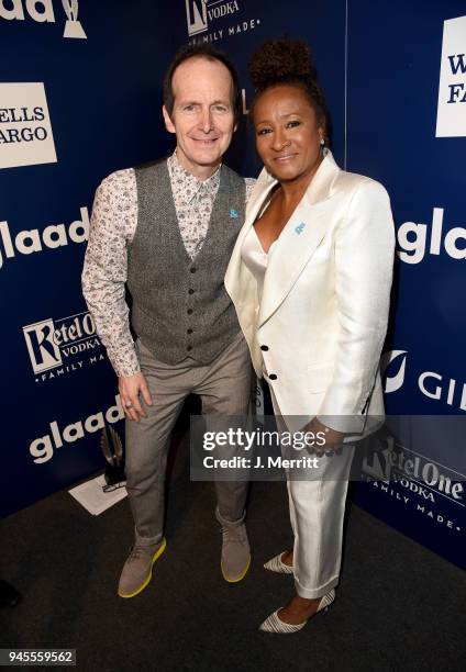 Denis O'Hare and host Wanda Sykes pose backstage at the 29th Annual GLAAD Media Awards at The Beverly Hilton Hotel on April 12, 2018 in Beverly...