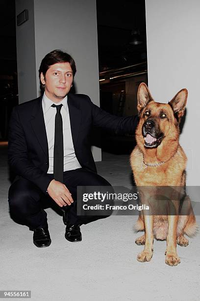 Vice president of Belstaff Michele Malenotti, poses with the dog Rex during the 'Belstaff Presents New Uniforms For Italian Police' at the Direzione...