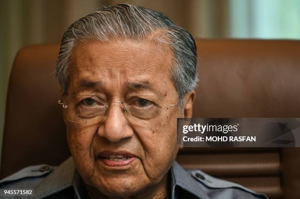 Former Malaysia's prime minister Mahathir Mohamad speaks during an interview with Agence France-Presse at his office in Kuala Lumpur on April 13,...