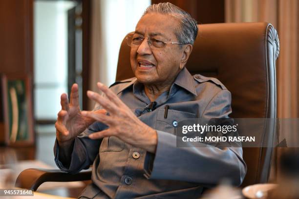 Former Malaysia's prime minister Mahathir Mohamad speaks during an interview with Agence France-Presse at his office in Kuala Lumpur on April 13,...