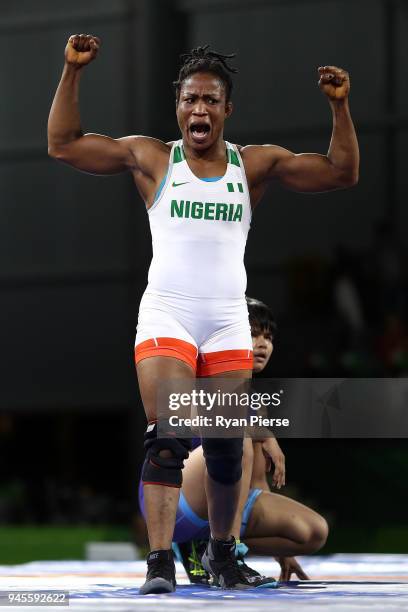 Blessing Oborududu of Nigeria celebrates victory over Divya Kakran of India in the Women's Freestyle 68 kg Semifinal on day nine of the Gold Coast...