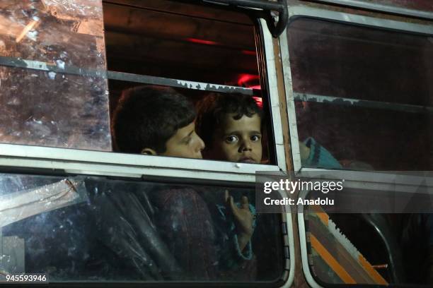 Syrian people from city the of Douma arrive in Al-Bab district of Aleppo, Syria on April 13, 2018. The 19th convoy carrying civilians and opposition...