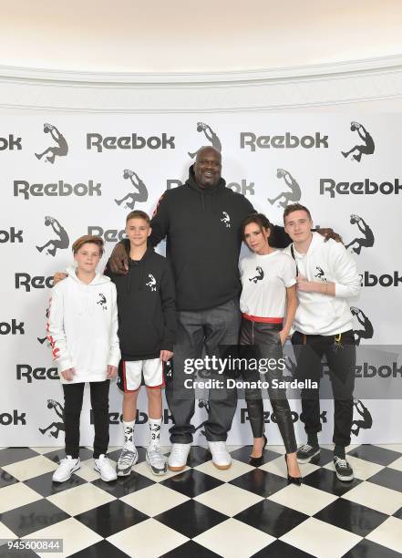 Cruz Beckham, Romeo Beckham, Shaquille O'Neal, Victoria Beckham and Brooklyn Beckham attend an event celebrating Reebok and Victoria Beckham...