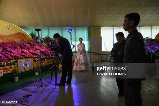 Visitors browse the 20th 'Kimilsungia' festival flower show in Pyongyang on April 13, 2018. When nuclear-armed North Korea put on a flower show last...