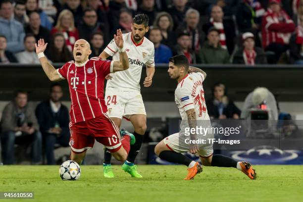 Sergio Escudero of Sevilla, Ever Banega of Sevilla and Arjen Robben of Muenchen battle for the ball during the UEFA Champions League quarter final...