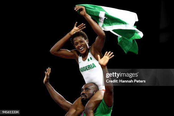 Odunayo Adekuoroye of Nigeria celebrates victory over Pooja Dhanda of India in the Women's Freestyle 57 kg Gold Medal match on day nine of the Gold...