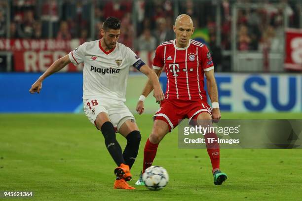 Sergio Escudero of Sevilla and Arjen Robben of Muenchen battle for the ball during the UEFA Champions League quarter final second leg match between...