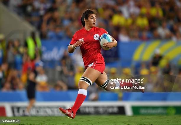 Bianca Farella of Canada breaks through to score a try during the Rugby Sevens Women's Pool A match between Canada and Kenya on day nine of the Gold...