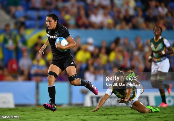 Sarah Goss of New Zealand makes a break to score a try during the Rugby Sevens Women's Pool A match between New Zealand and South Africa on day nine...