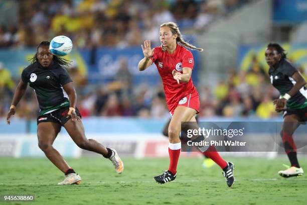 Megan Lukan of Canada passes in the match between Kenya and Canada during Rugby Sevens on day nine of the Gold Coast 2018 Commonwealth Games at...