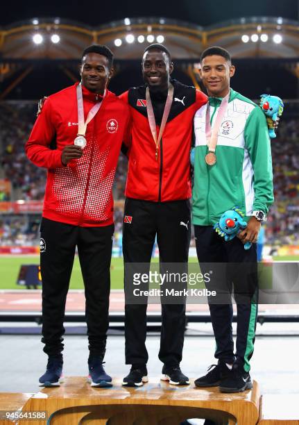 Silver medalist Aaron Brown of Canada, gold medalist Hereem Richards of Trinidad and Tobago and bronze medalist Leon Reid of Northern Ireland pose...