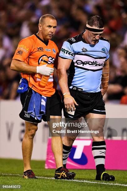 Paul Gallen of the Sharks is assisted from the field during the round six NRL match between the St George Illawarra Dragons and the Cronulla Sharks...