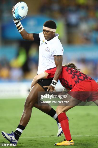 Litia Naiqato of Fiji is tackled in the game between Canada and Fiji during Rugby Sevens on day nine of the Gold Coast 2018 Commonwealth Games at...