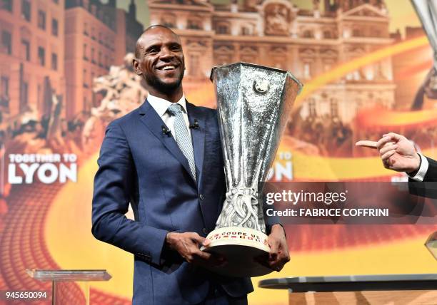 Former French football player and ambassador for the UEFA Europa League final in Lyon, Eric Abidal poses after the handover of the trophy following...