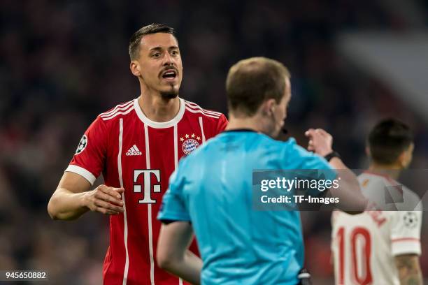 Sandro Wagner of Muenchen speaks with Referee William Collum during the UEFA Champions League quarter final second leg match between Bayern Muenchen...