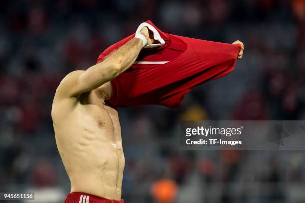 Arjen Robben of Muenchen takes off his jersey after the UEFA Champions League quarter final second leg match between Bayern Muenchen and Sevilla FC...