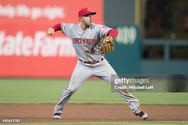 Cliff Pennington of the Cincinnati Reds throws the ball to first base against the Philadelphia Phillies at Citizens Bank Park on April 9, 2018 in...