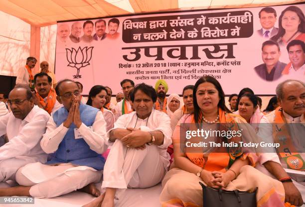 Union ministers Suresh Prabhu, Vijay Goel, Anant Geete, Narender Tomar, BJP MP Meenakshi Lekhi and other leaders during a protest against the...