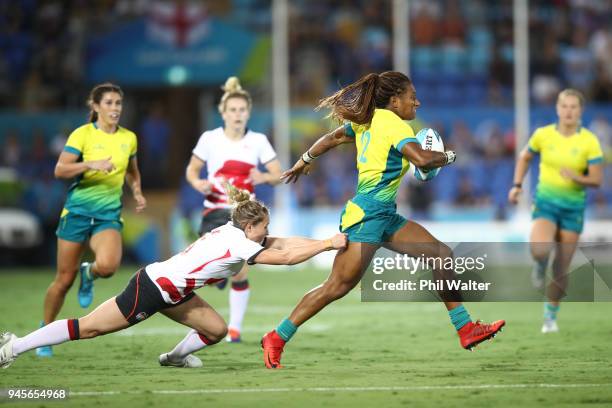 Ellia Green of Australia runs in for a try in the match between Australia and England during Rugby Sevens on day nine of the Gold Coast 2018...