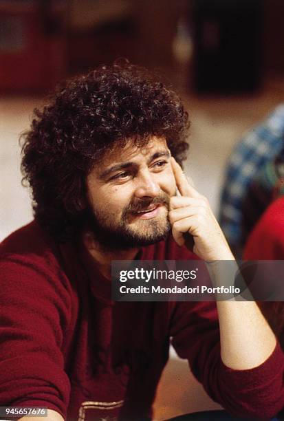 The comedian Beppe Grillo smiling. 1981