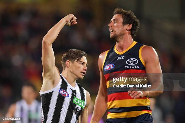 Josh Thomas of the Magpies celebrates after kicking a goal during the round four AFL match between the Adelaide Crows and the Collingwood Magpies at...