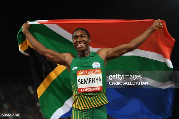 South Africa's Caster Semenya celebrates with flag after winning the athletics women's 800m final during the 2018 Gold Coast Commonwealth Games at...