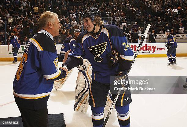 Brett Hull shakes hand with T.J. Oshie of the St. Louis Blues before a game against the Calgary Flames on December 15, 2009 at Scottrade Center in...