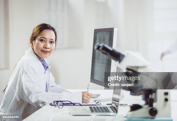 Asian Woman Microscope Photos and Premium High Res Pictures - Getty Images