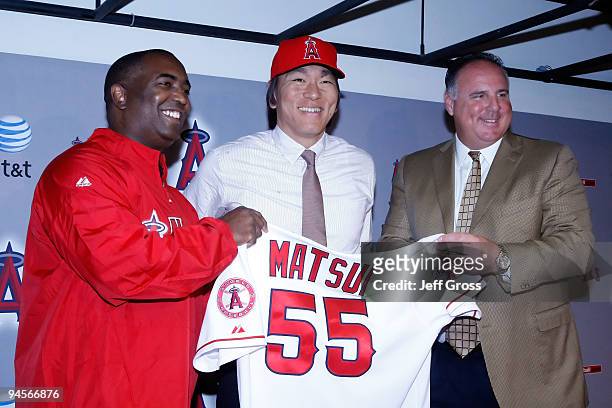 General manager Tony Reagins, Hideki Matsui and manager Mike Scioscia of the Los Angeles Angels of Anaheim pose for a portrait during a press...