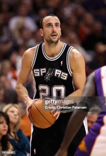 Manu Ginobili of the San Antonio Spurs looks to shoot during the NBA game against the Phoenix Suns at US Airways Center on December 15, 2009 in...