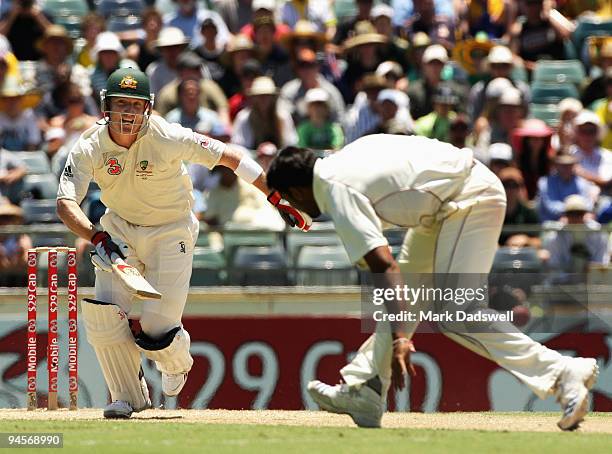 Brad Haddin of Australia straight drives past Ravi Rampaul of the West Indies during day two of the Third Test match between Australia and the West...