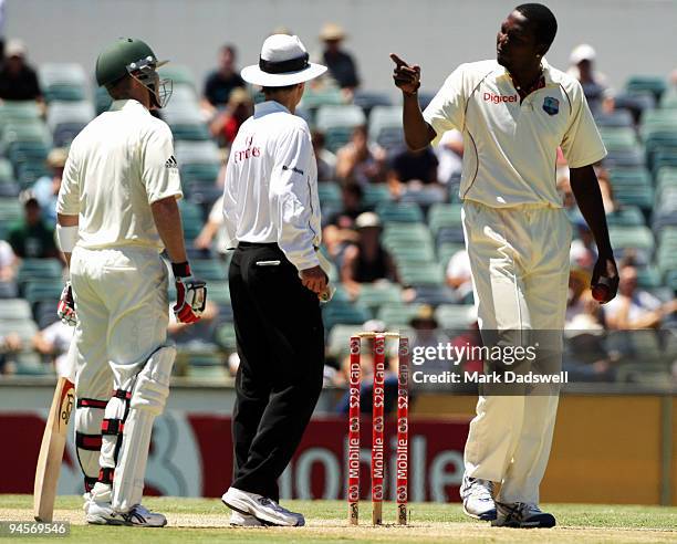 Brad Haddin of Australia and Sulieman Benn of the West Indies have words as Umpire Billy Bowden intervenes during day two of the Third Test match...