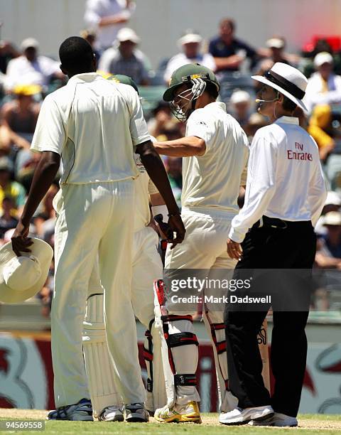 Mitchell Johnson of Australia pushes Sulieman Benn of the West Indies away from Brad Haddin of Australia during day two of the Third Test match...