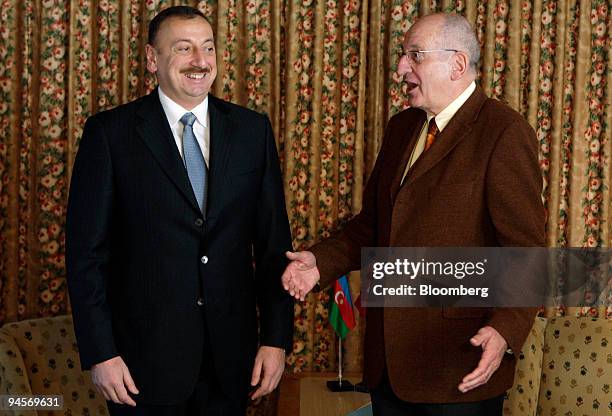 Pascal Couchepin, president of the Swiss confederation and federal councilor of home affairs, right, speaks with Ilham Aliyev, right, president of...