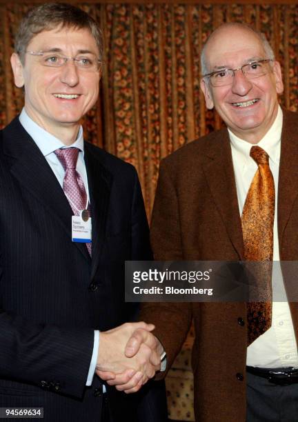 Pascal Couchepin, president of the Swiss confederation and federal councilor of home affairs, right, shakes hands with Ferenc Gyurcsany, prime...