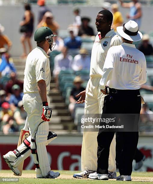 Brad Haddin of Australia and Sulieman Benn of the West Indies have words as Umpire Billy Bowden intervenes during day two of the Third Test match...
