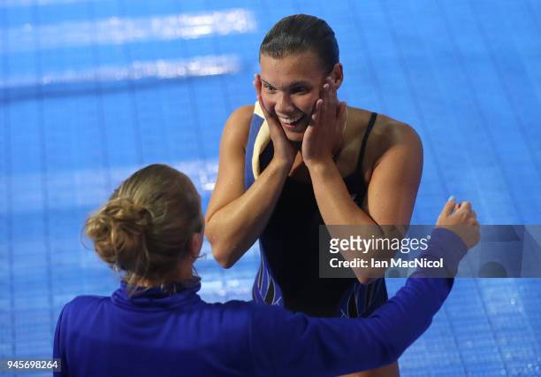 Grace Reid of Scotland is seen with her coach Jen Leeming after winning the Women's 1m Springboard final during Diving on day nine of the Gold Coast...