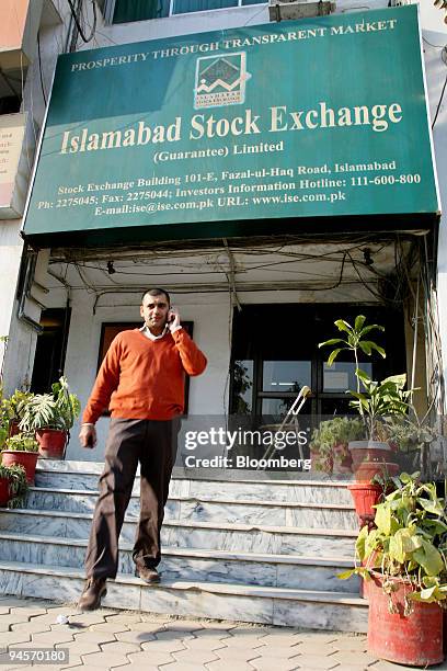 Man walks out of the Islamabad Stock Exchange in Islamabad, Pakistan, on Tuesday, Jan. 1, 2008. The Islamabad Stock Exchange is one of three stock...